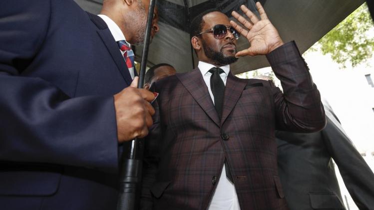 R. Kelly arrives for a hearing on sexual abuse charges in Chicago