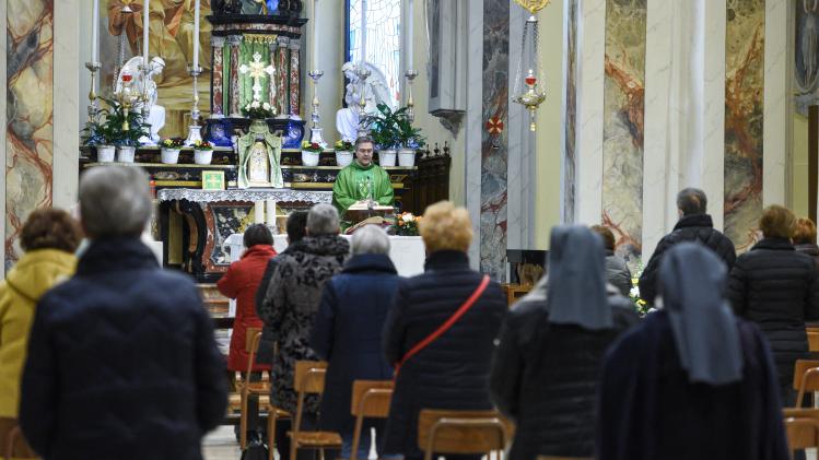 Don Giuseppe Corbari, parson of the Church of Robbiano, holds mass in Giussano, Italy