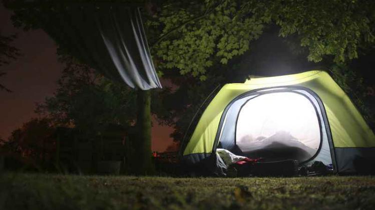 Illuminated tent and hamock at night