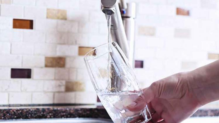 Filling glass with tap water