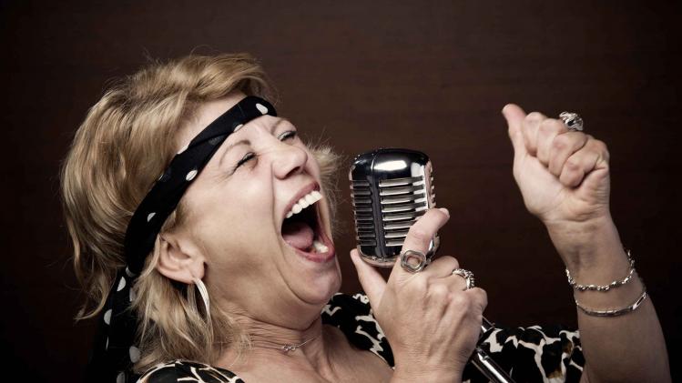 Senior woman rock star singing