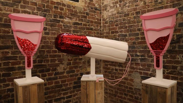 Models_of_a_pair_of_menstrual_cups_and_a_tampon_are_on_display_during_the_press_