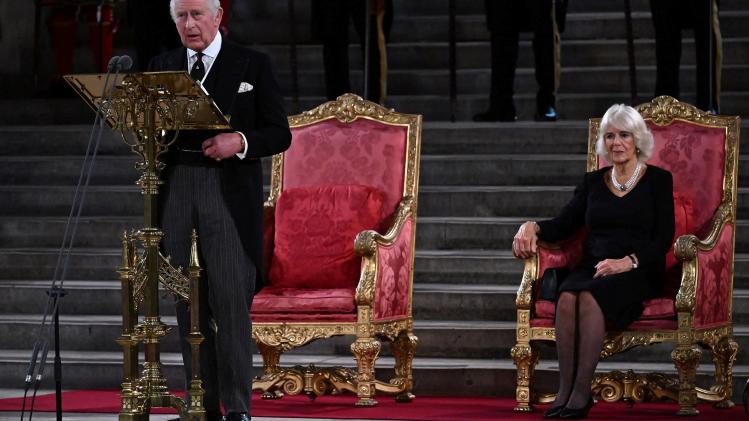 Britain_s_King_Charles_III_flanked_by_Britain_s_Camilla_Queen_Consort_speaks_dur