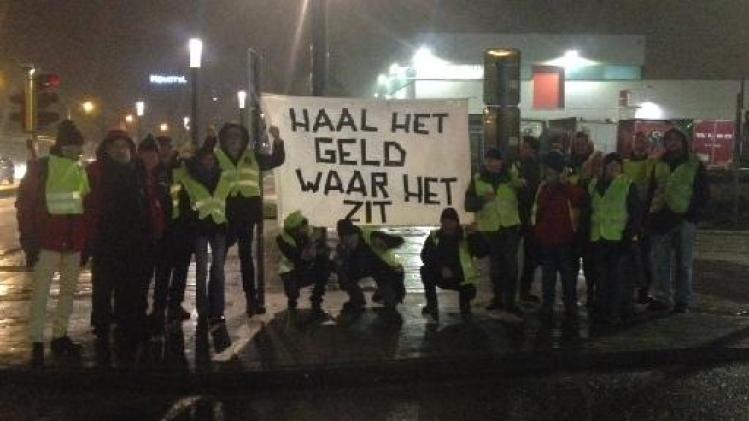 Gele hesjes - Groepje 'gele hesjes' voert actie bij AB InBev in Leuven