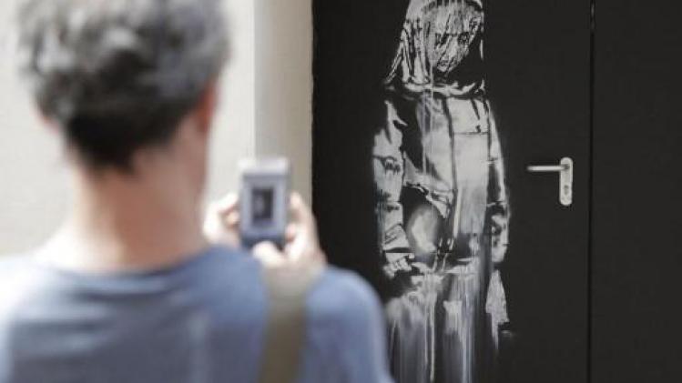 Kunstwerk van Banksy op deur van Bataclan in Parijs gestolen