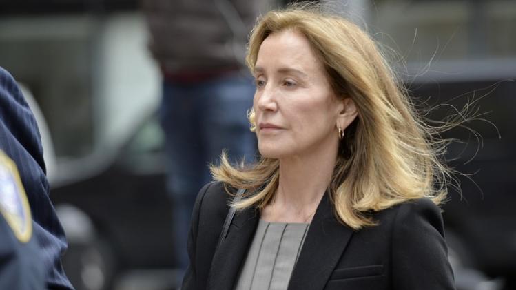 Felicity Huffman expected to plead guilty to using bribery to get daughter into university