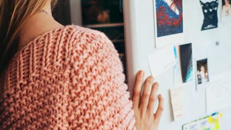woman-wearing-pink-knit-top-opening-refrigerator-1458687