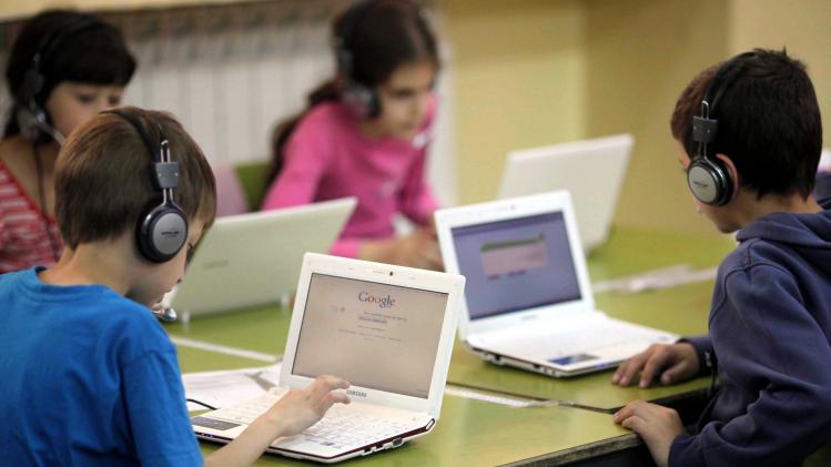 Israeli school kids with computers in Jerusalem