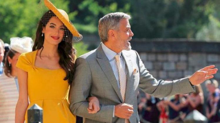 George Clooney staat in schaduw van zijn vrouw