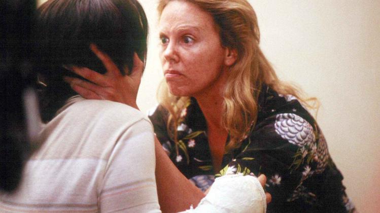 Charlize Theron as Aileen Wuornos and Christina Ricci as Selby Wall in Monster.