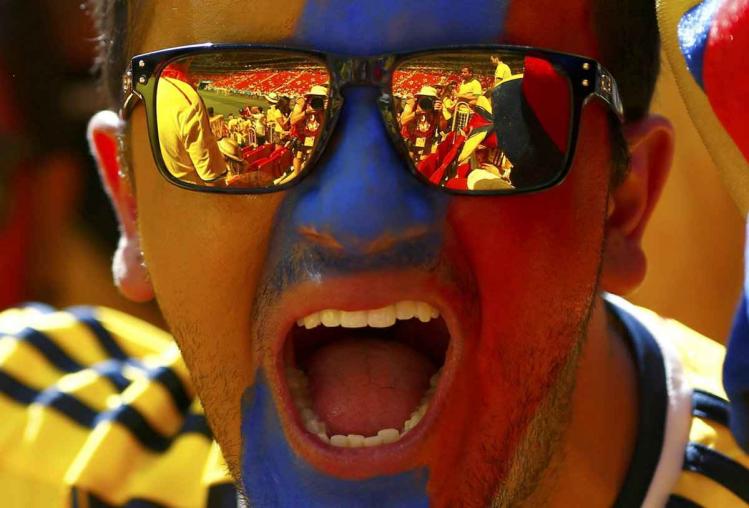 the-stadium-reflects-in-a-colombia-fans-sunglasses.jpg