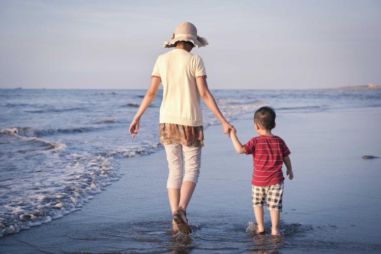 mother-and-boy-walking-on-the-beach-1.jpg