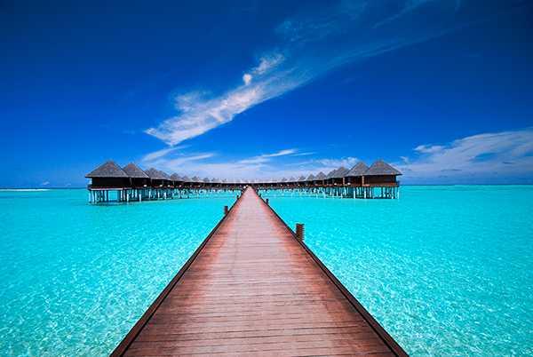 10010-a-bridge-leading-to-water-bungalows-on-the-ocean-pv.jpg